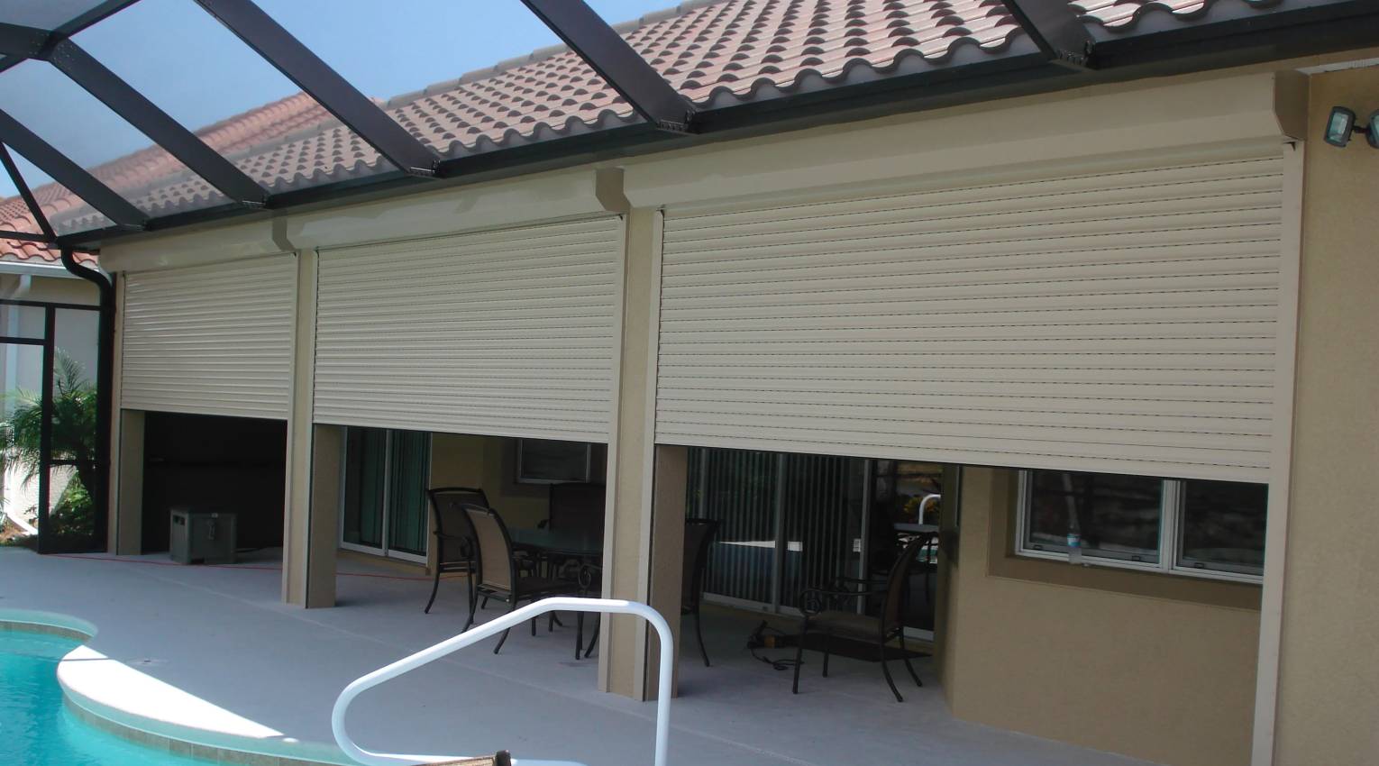 Motorized roll-down shutters hurricane home protection