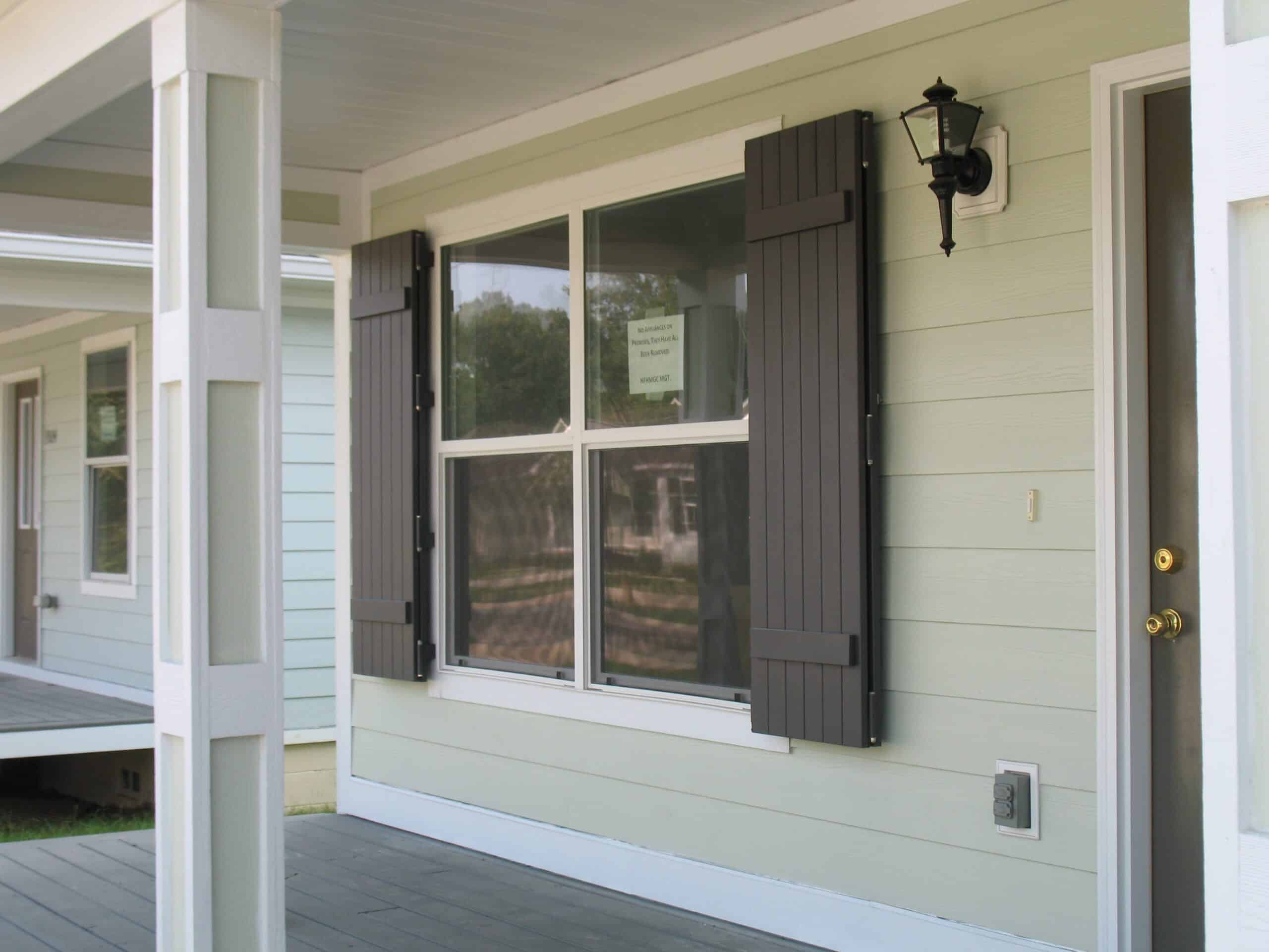 Detailed view of beautiful Colonial shutters, highlighting their classic architectural design