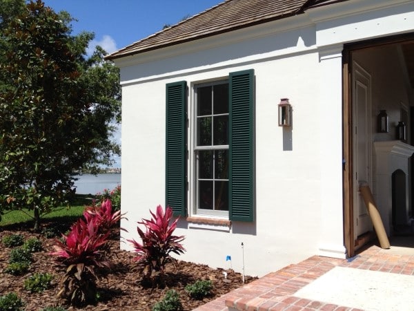 Detailed view of open Colonial shutters, highlighting their classic architectural design